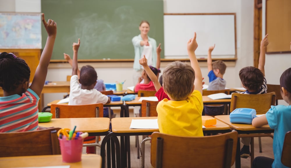 Pinwheel supports kids in the classroom from elementary to middle school a healthier safer smartphone that can be used for education pictured here a teacher calls on young kids who don't have phones in a classroom at an elementary school