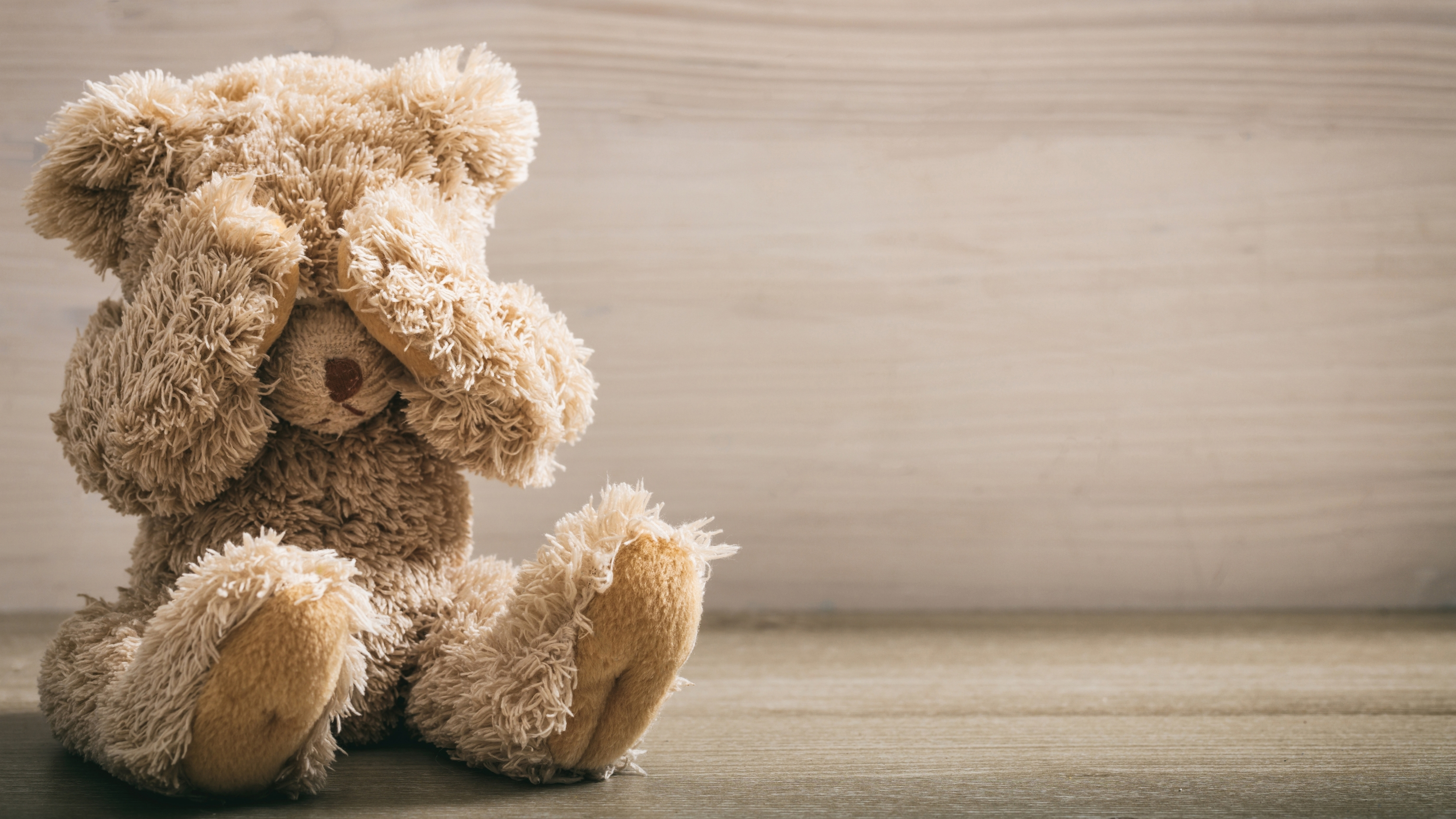 understanding the kid device attachment, teddy bear covering its eyes, Pinwheel the healthy kid phone.